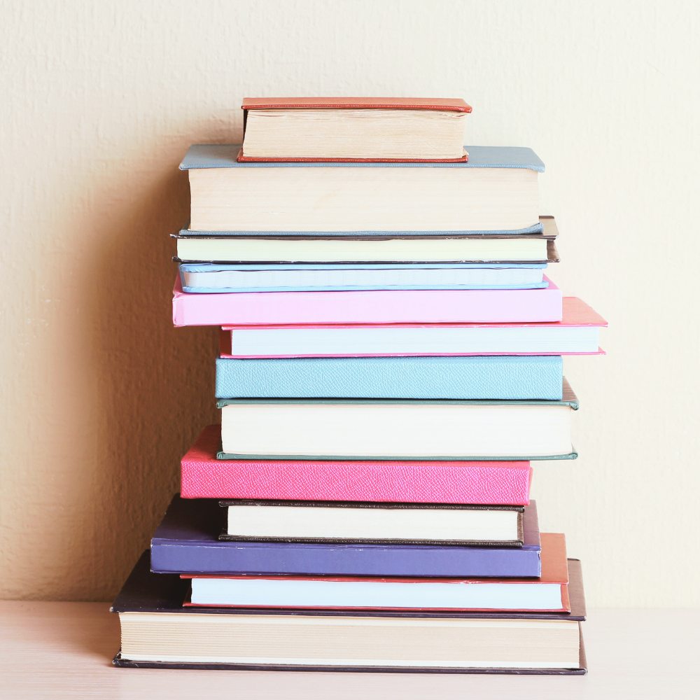 Stack of coloured books.